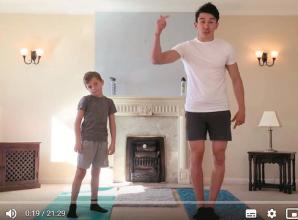 Ethan helps Sunderland's Luke O'Nien work out to raise cash for the NHS