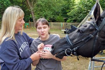 Horsing around: Racehorse visits children’s special needs day centre